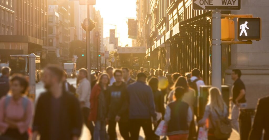 Diverse,crowd,of,anonymous,people,walking,down,a,busy,street